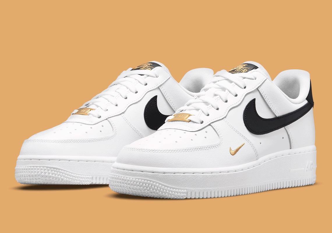 Nike Hits This Clean "White/Black" Air Force 1 With Gold Mini-Swooshes