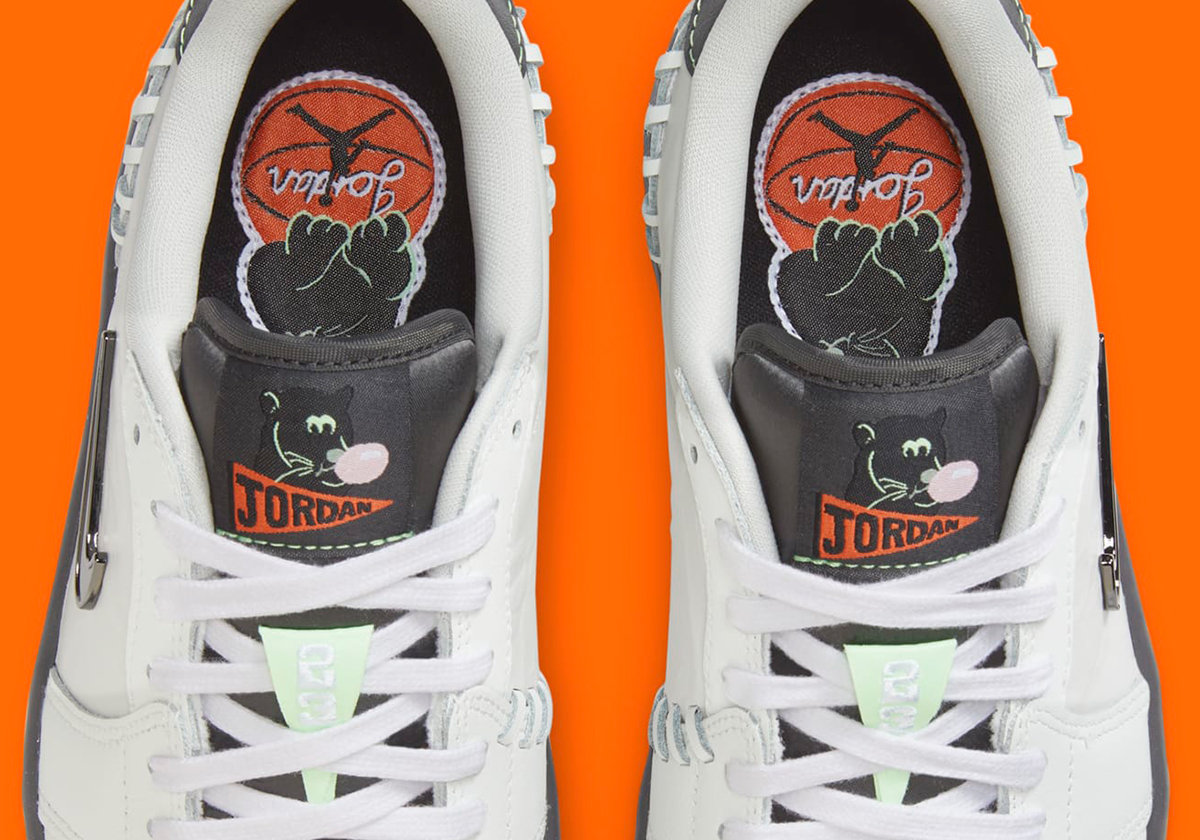 A Cartoon Black Cat Prowls On The Air Jordan 1 Low Method Of Make