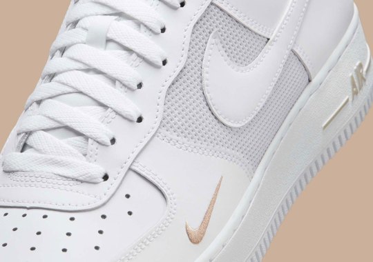 Nike Remixes The “Triple White” Air Force 1 With A Mini Swoosh